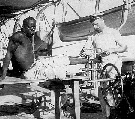 African Slave Being Shackled