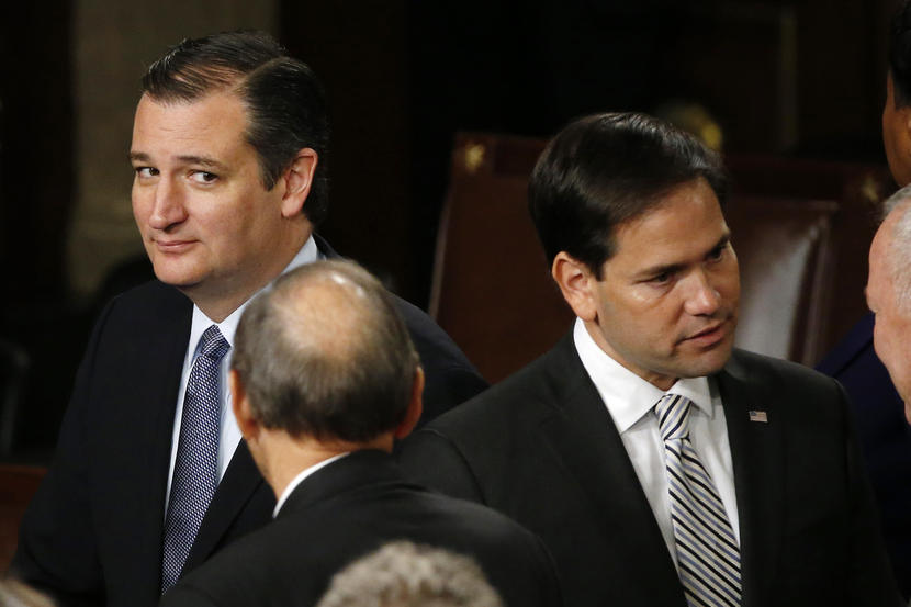 Republican U.S. presidential candidate and Senator Ted Cruz (L) looks over at rival candidate Senator Marco Rubio (2nd R) after Pope Francis' address before a joint meeting of the U.S. Congress in the House of Representatives Chamber on Capitol Hill in Washington September 24, 2015. REUTERS/James Lawler Duggan  - RTX1SAE2